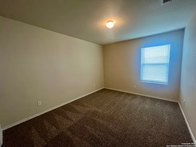 an empty room with a empty space and window