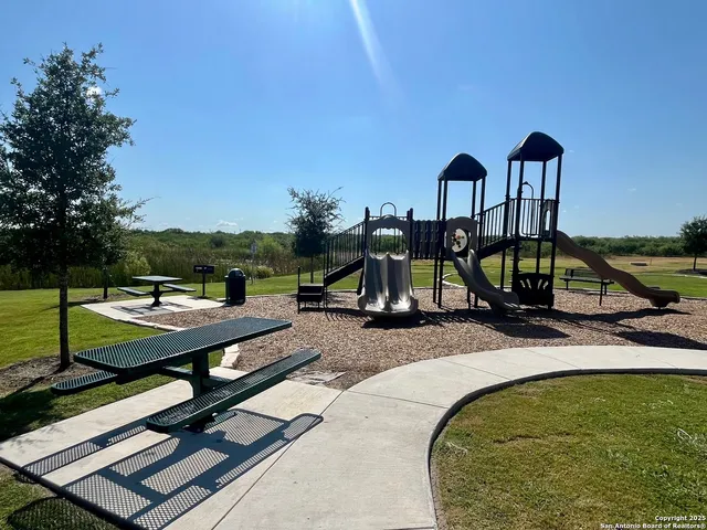 a view of a swimming pool with a lounge chairs