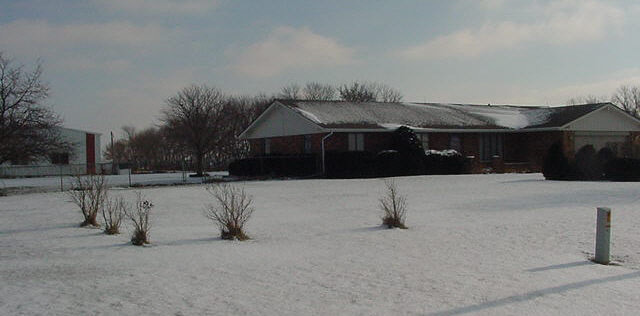 4350 South Hoisington Road Winnebago, IL 61088 - Photo 1 of 1 a view of a house with a yard