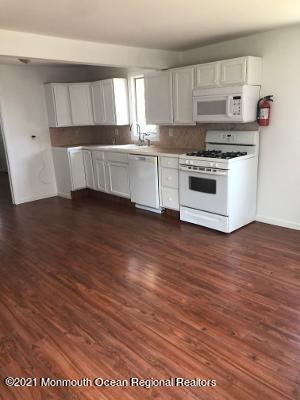 90 County Road Cliffwood, NJ 07721 - Photo 2 of 12 a kitchen with stainless steel appliances granite countertop a stove a sink and white cabinets