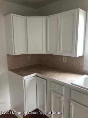 90 County Road Cliffwood, NJ 07721 - Photo 3 of 12 a kitchen with a sink and cabinets