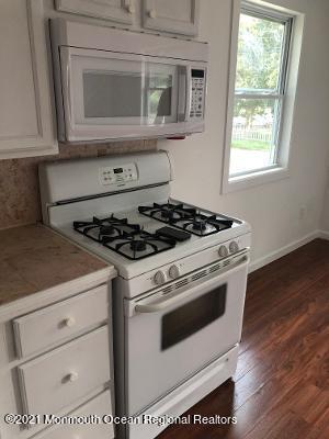 90 County Road Cliffwood, NJ 07721 - Photo 4 of 12 a white stove top oven sitting inside of a kitchen