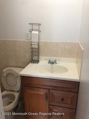 90 County Road Cliffwood, NJ 07721 - Photo 6 of 12 a bathroom with a sink a toilet and a mirror