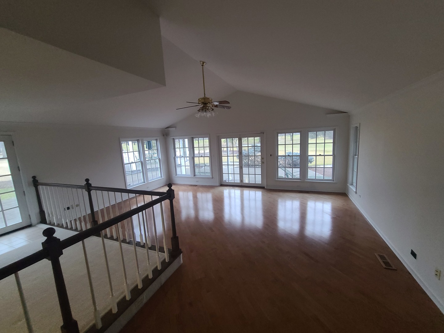 630 Greenview Road Itasca, IL 60143 - Photo 2 of 15 a view of livingroom with hardwood floor and windows