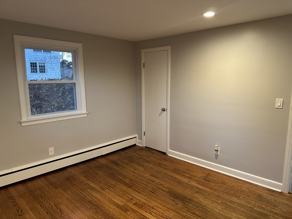 3 Tryon Road Norwalk, CT 06851 - Photo 12 of 25 a view of an empty room with wooden floor