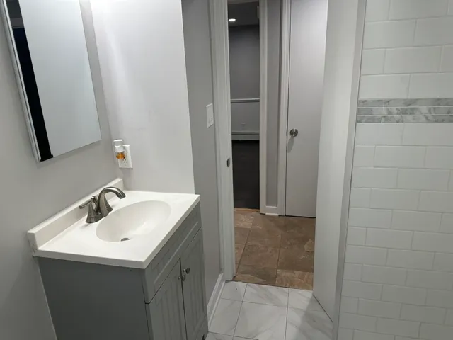 a bathroom with a sink and a mirror
