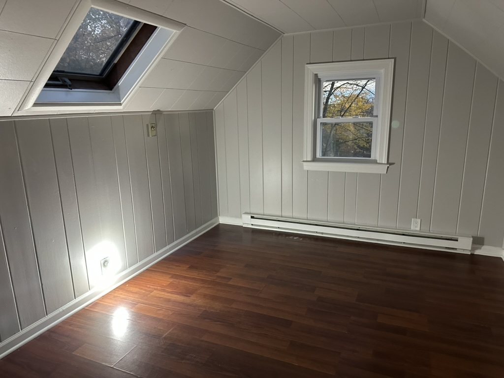 3 Tryon Road Norwalk, CT 06851 - Photo 16 of 25 an empty room with wooden floor and windows