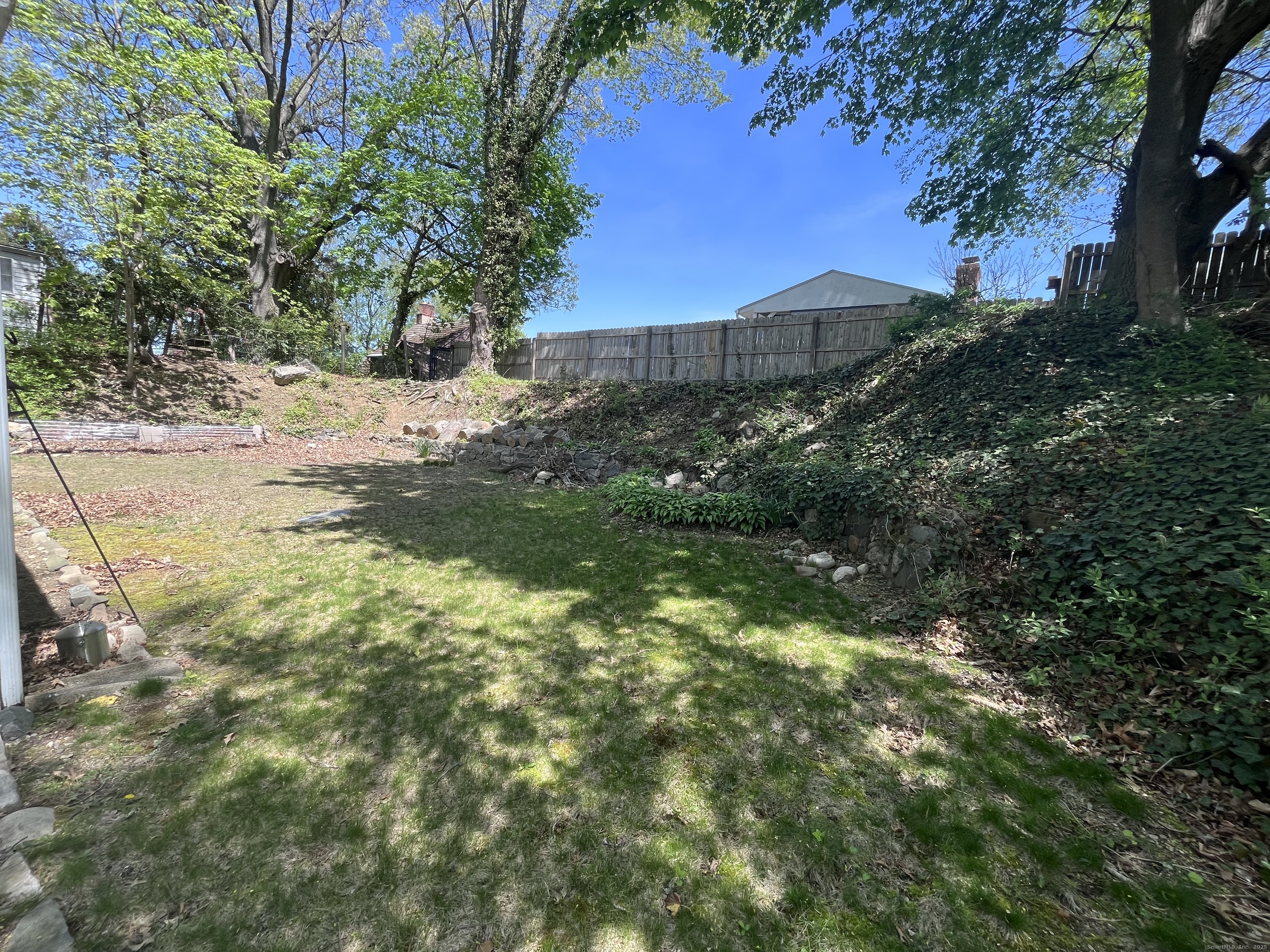 3 Tryon Road Norwalk, CT 06851 - Photo 4 of 25 a view of a yard with plants and trees
