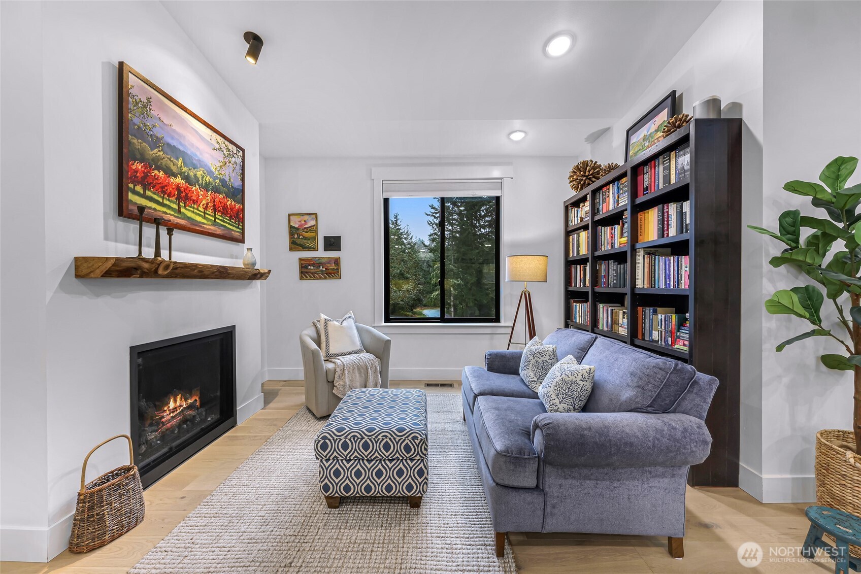 4336 Meander Lane Langley, WA 98260 - Photo 14 of 36 a living room with furniture a bookshelf and a fireplace