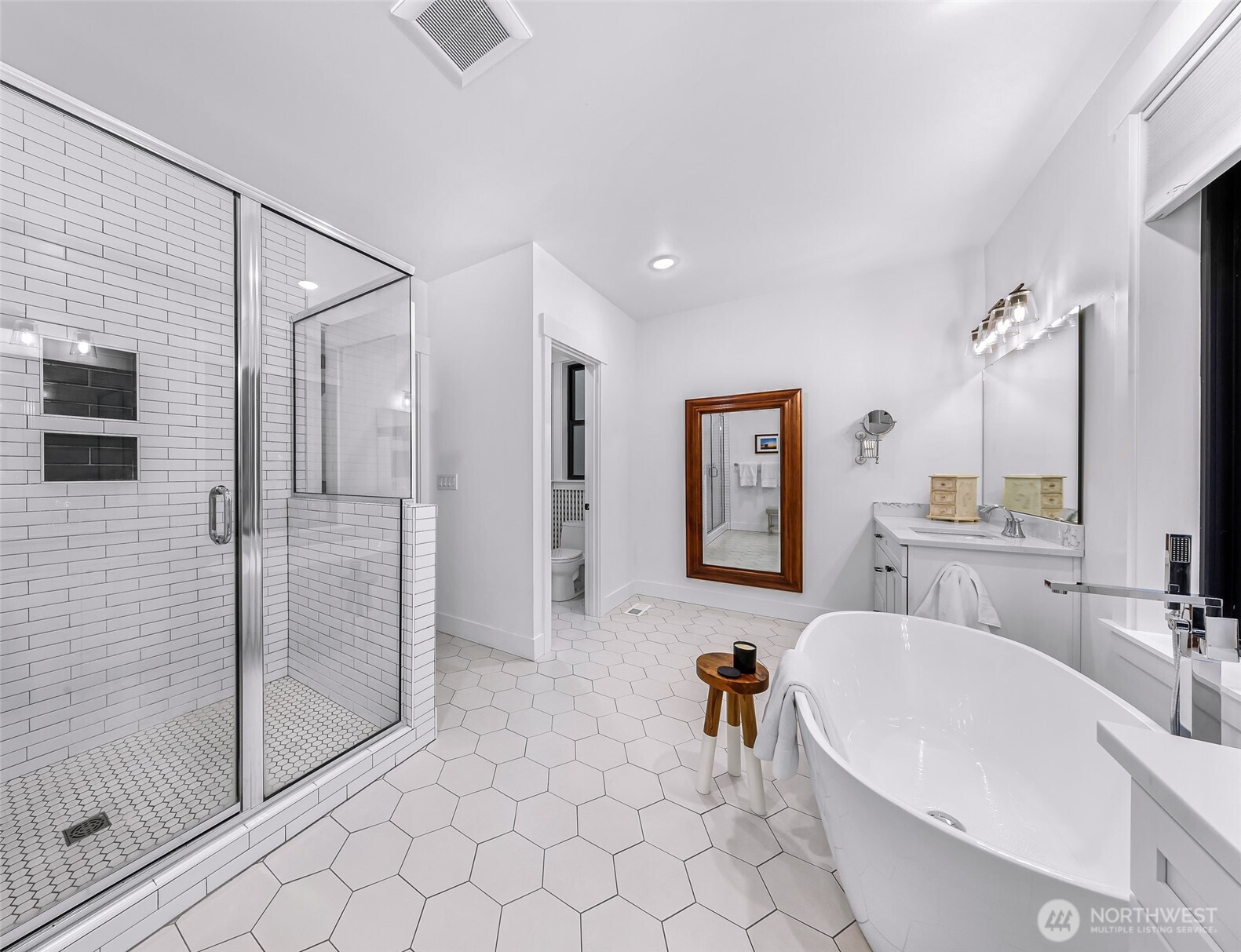 4336 Meander Lane Langley, WA 98260 - Photo 19 of 36 a bathroom with a bathtub and a double vanity sink mirror