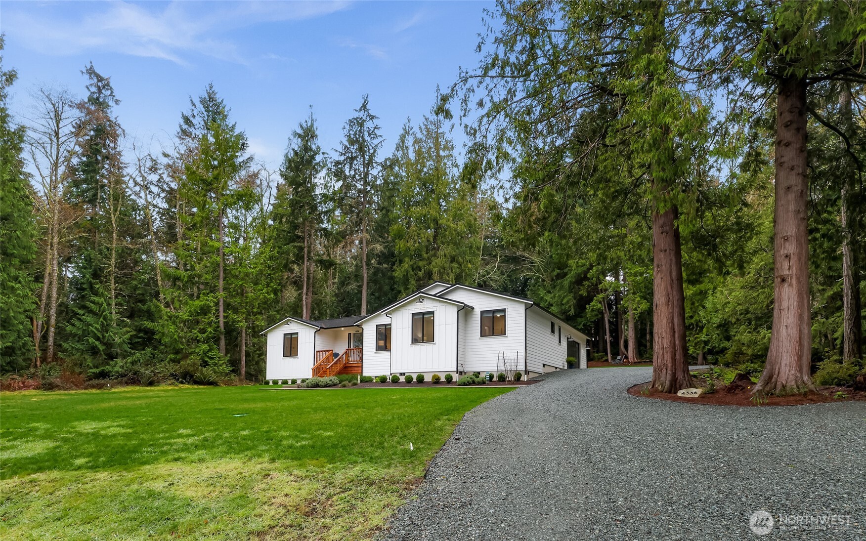 4336 Meander Lane Langley, WA 98260 - Photo 2 of 36 a front view of a house with a yard and trees