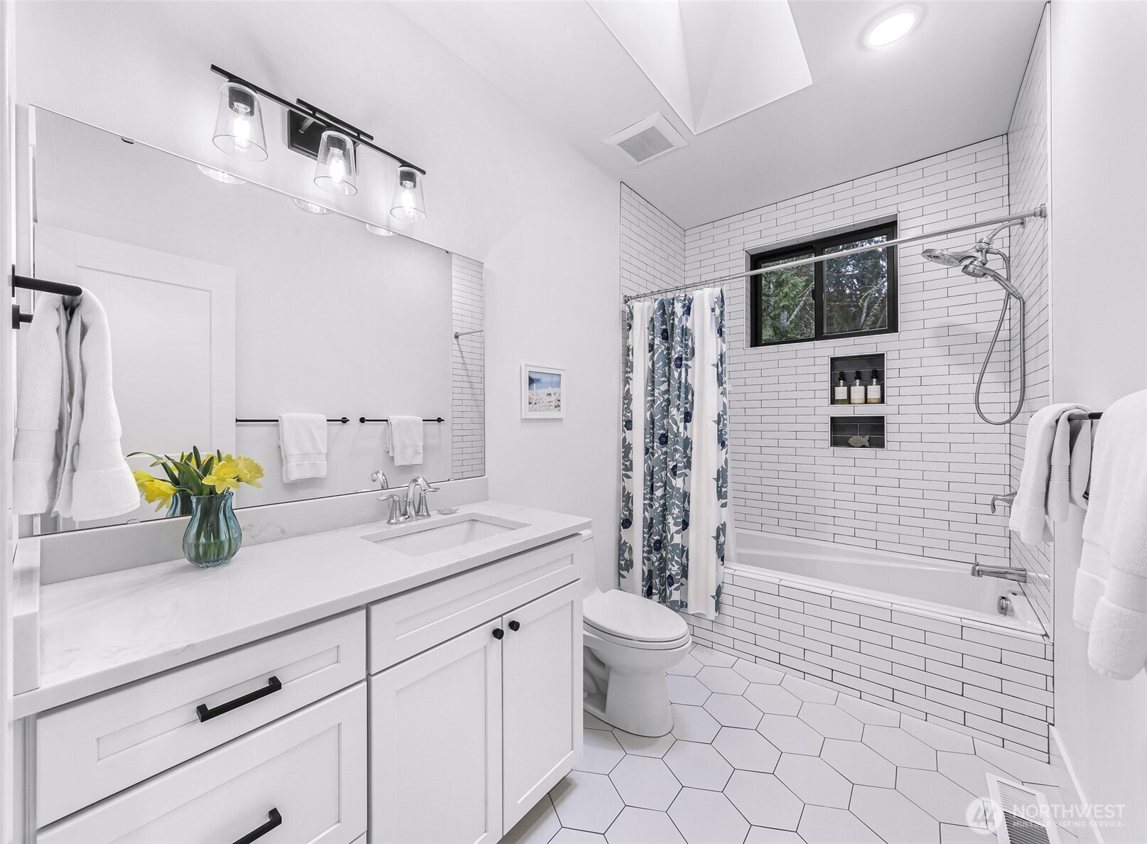 4336 Meander Lane Langley, WA 98260 - Photo 24 of 36 a bathroom with a granite countertop sink a toilet a mirror and shower