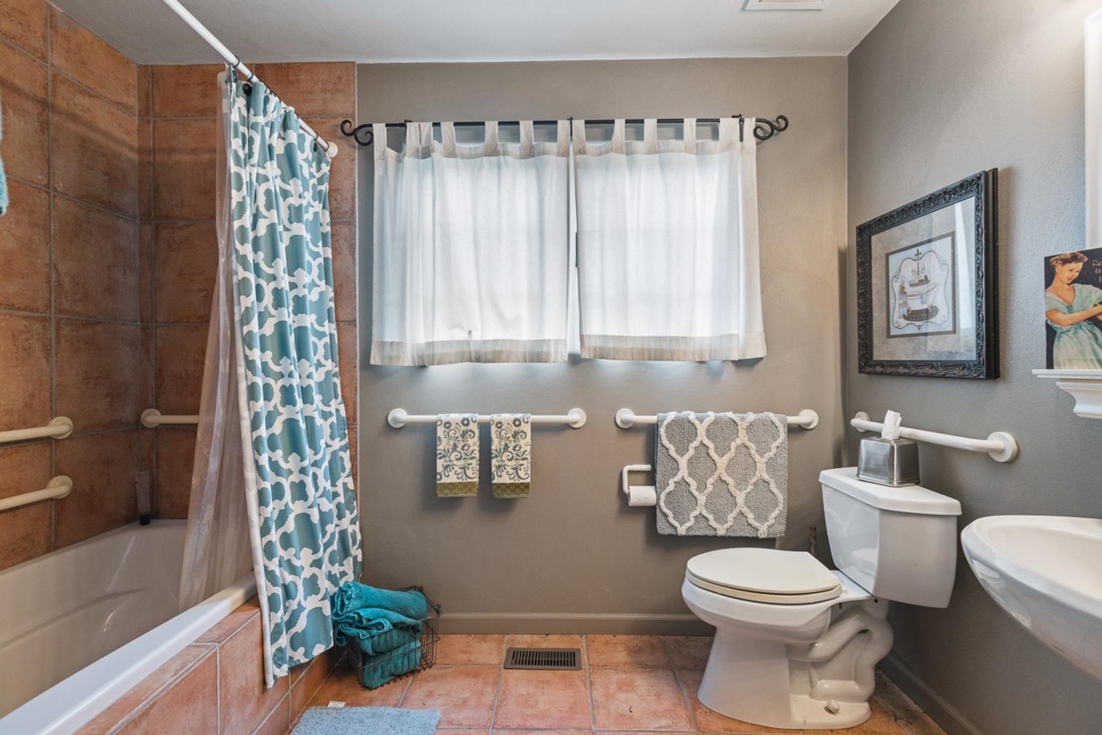 1511 West Demeter Drive Freeport, IL 61032 - Photo 45 of 78 a bathroom with a toilet and shower curtain