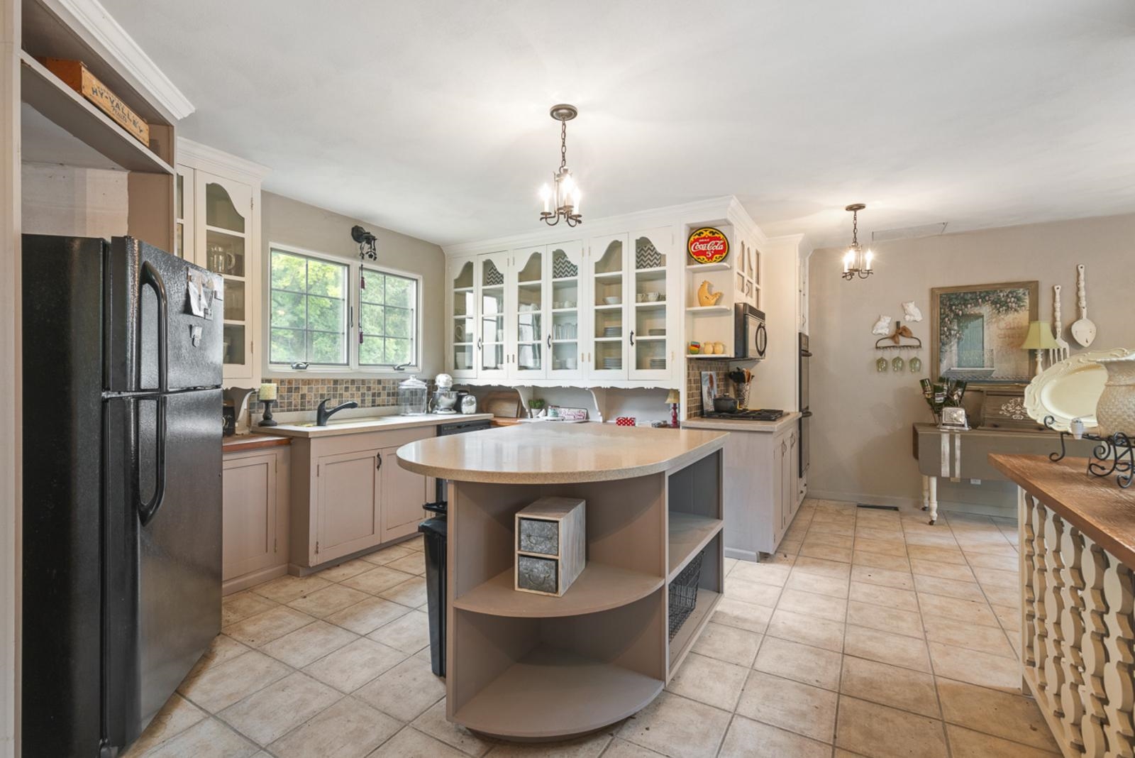 1511 West Demeter Drive Freeport, IL 61032 - Photo 51 of 78 a kitchen with stainless steel appliances granite countertop a sink stove and refrigerator