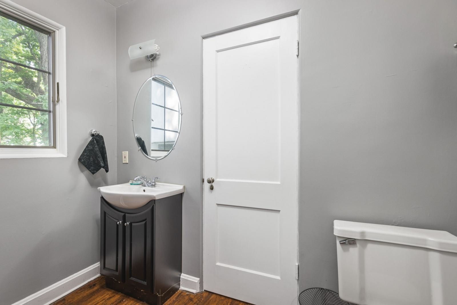 1511 West Demeter Drive Freeport, IL 61032 - Photo 62 of 78 a room with a sink a mirror and a window