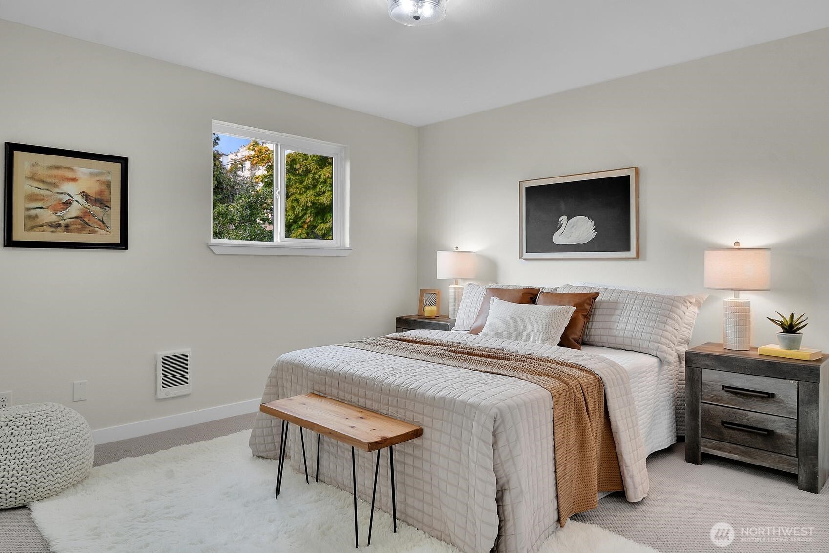 161 Valley Street Seattle, WA 98109 - Photo 13 of 40 a bedroom with a bed and a lamp on dresser