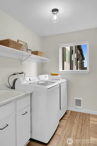 a utility room with cabinets