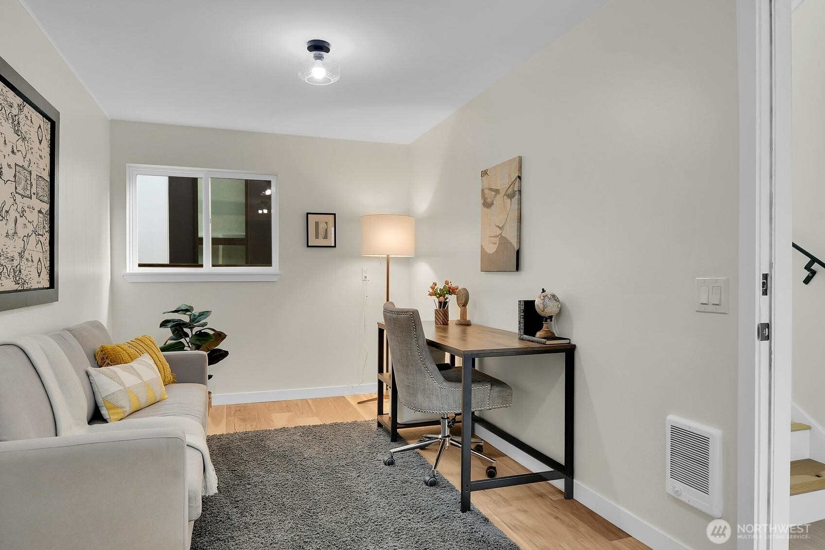 161 Valley Street Seattle, WA 98109 - Photo 15 of 40 a view of a livingroom with workspace and a couch