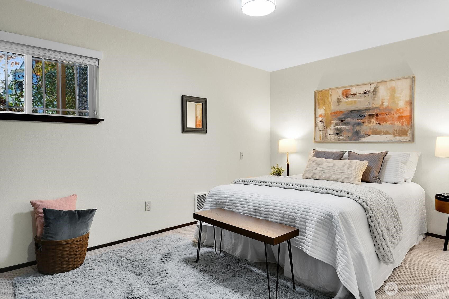 161 Valley Street Seattle, WA 98109 - Photo 34 of 40 a bedroom with a bed and a painting on the wall