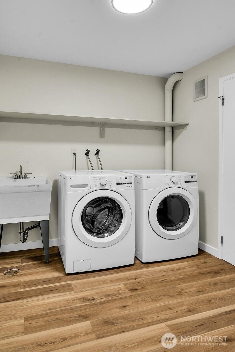 161 Valley Street Seattle, WA 98109 - Photo 35 of 40 a utility room with dryer and washer