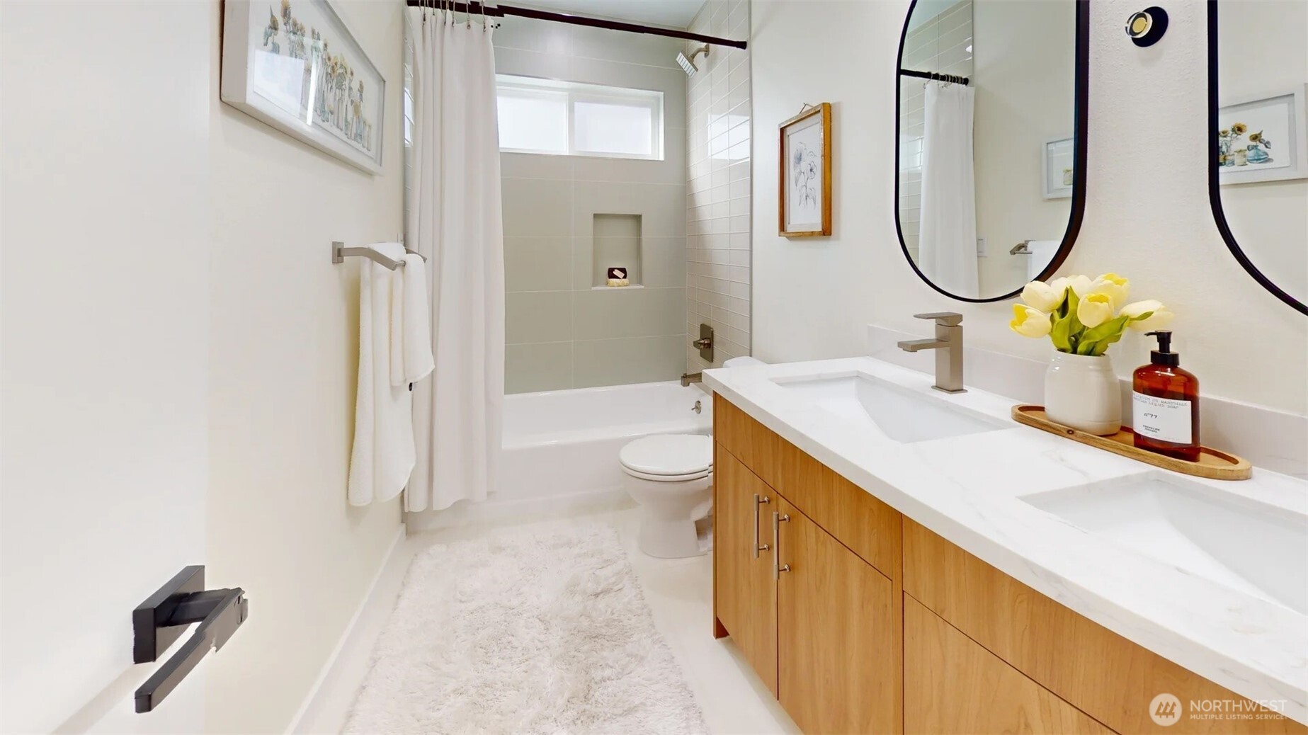 161 Valley Street Seattle, WA 98109 - Photo 8 of 40 a spacious bathroom with a sink a toilet and a mirror