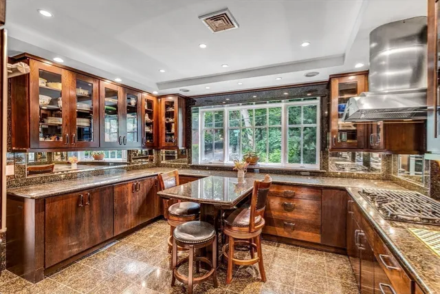 a kitchen with stainless steel appliances granite countertop a stove and a sink