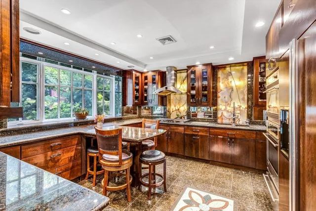 a view of a two chairs in the balcony