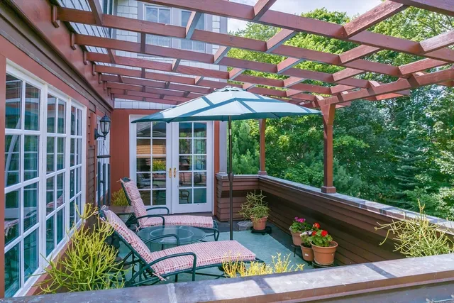 a view of a chairs and table in a patio