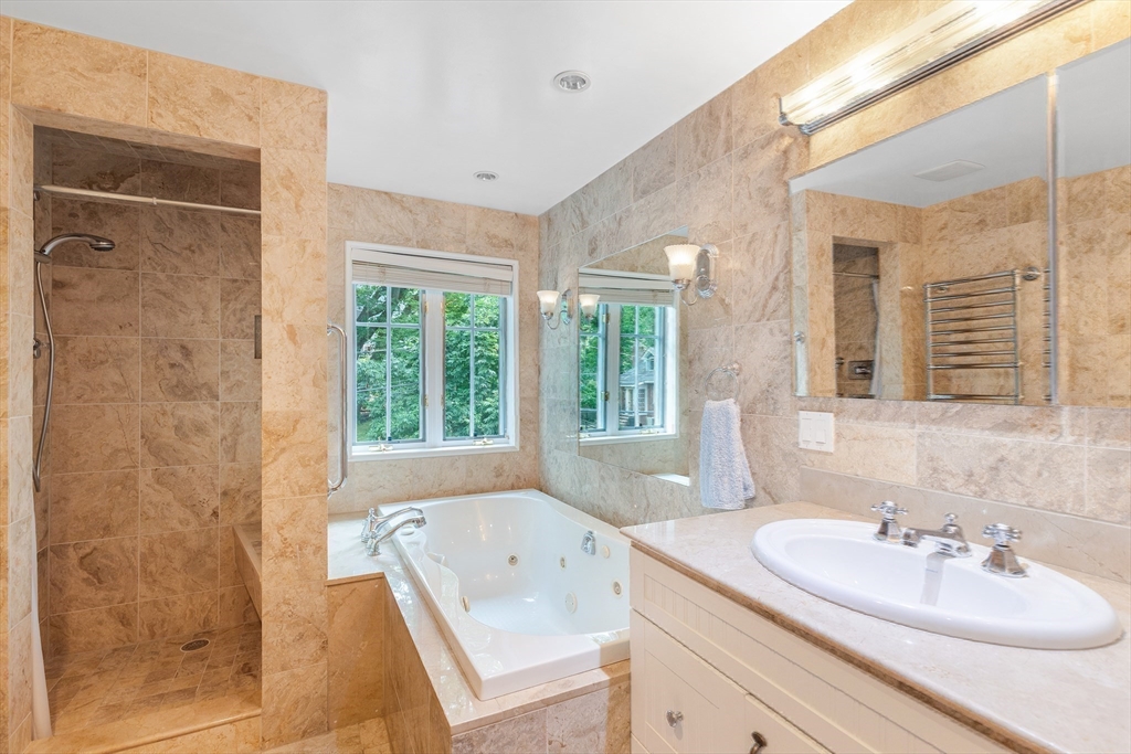 45 Parley Avenue Boston, MA 02130 - Photo 17 of 24 a bathroom with a tub sink and mirror