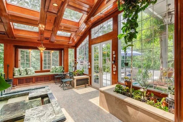 a view of patio with chairs and table with chairs and a small yard