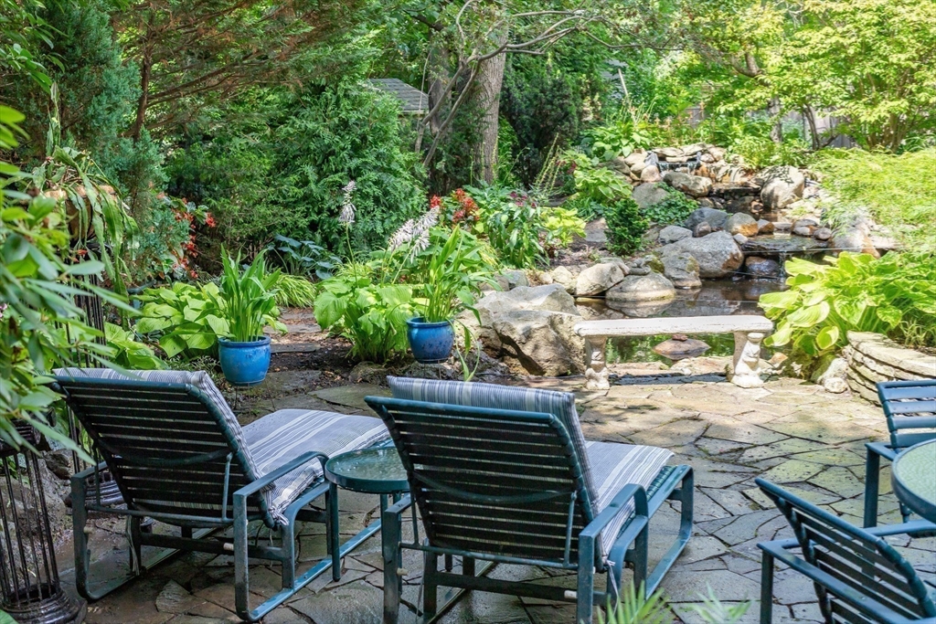 45 Parley Avenue Boston, MA 02130 - Photo 21 of 24 a view of a patio with table and chairs and potted plants