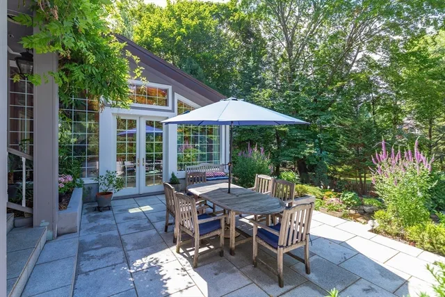 a view of a patio with furniture and wooden floor