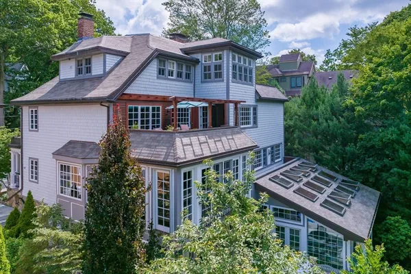 a aerial view of a house with a yard