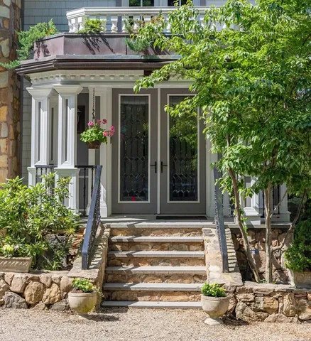 a front view of a house with a porch
