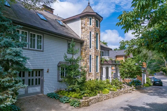 a front view of a house with garden