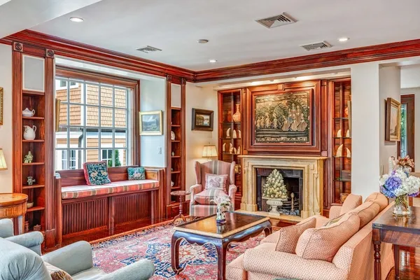 a living room with furniture fireplace and flat screen tv