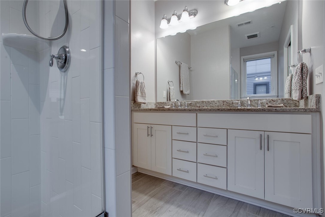 447 Nottoway Walk Alexandria, VA 22304 - Photo 15 of 49 Full bathroom with a stall shower, double vanity,