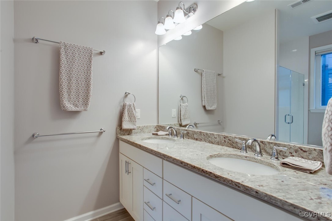 447 Nottoway Walk Alexandria, VA 22304 - Photo 16 of 49 Full bathroom with double vanity and a stall showe