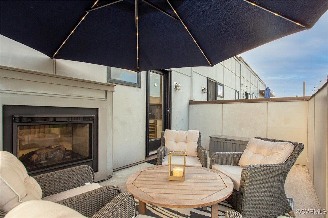 447 Nottoway Walk Alexandria, VA 22304 - Photo 27 of 49 View of patio featuring a glass covered fireplace