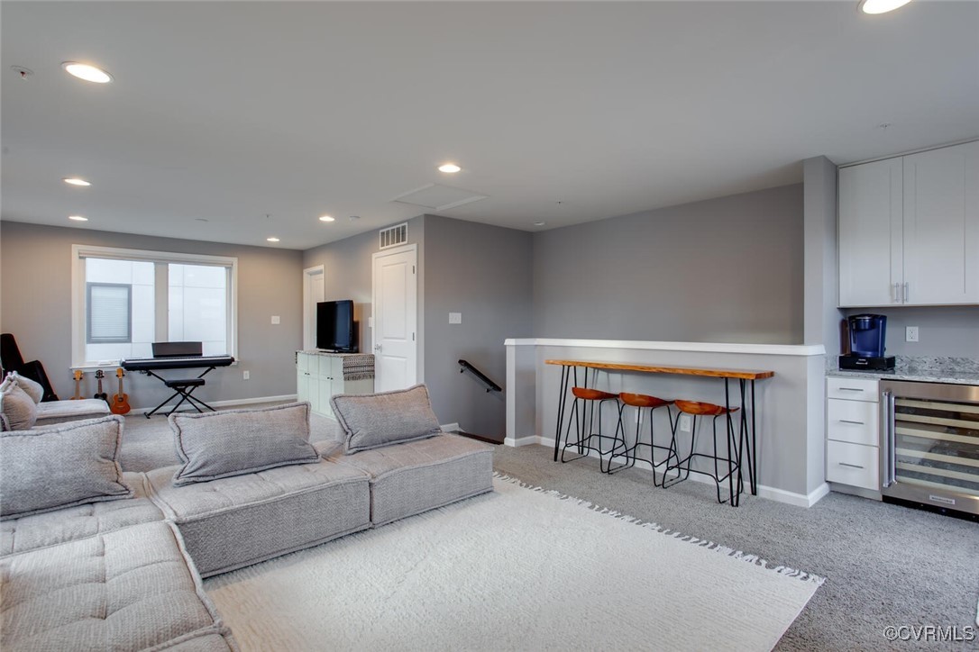 447 Nottoway Walk Alexandria, VA 22304 - Photo 33 of 49 Living area featuring beverage cooler, a dry bar,