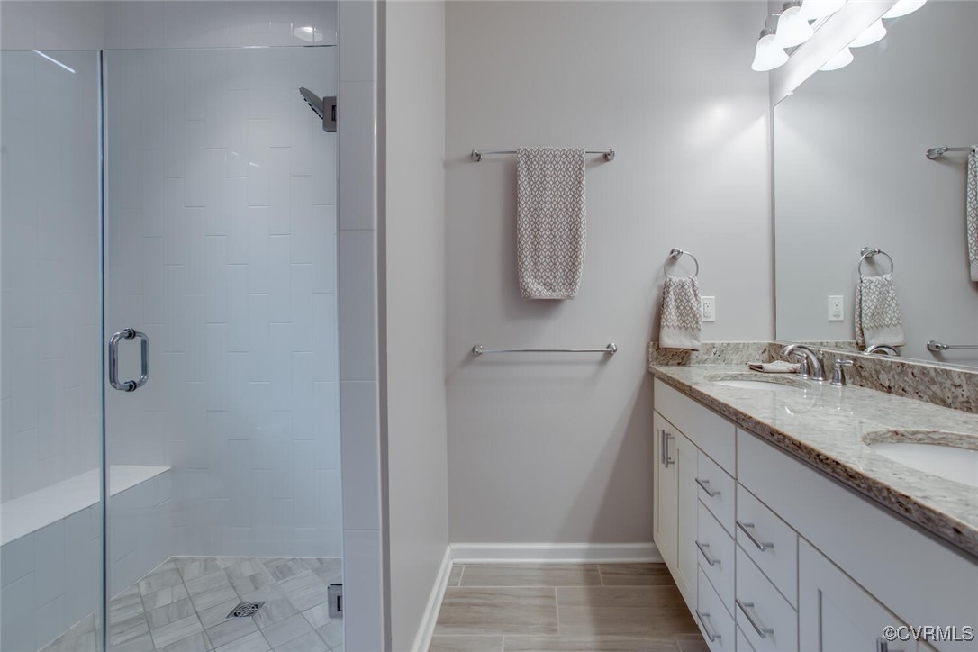 447 Nottoway Walk Alexandria, VA 22304 - Photo 8 of 49 Bathroom featuring double vanity and a stall showe