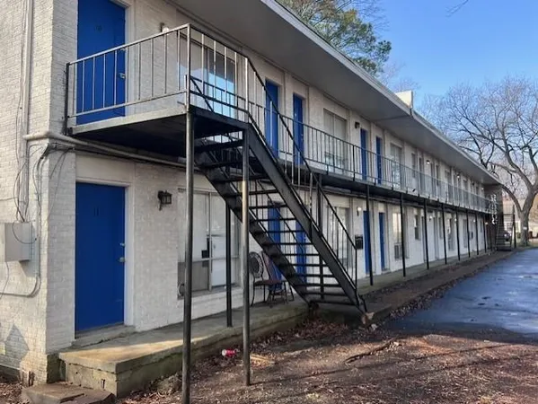 a view of a house with wooden stairs