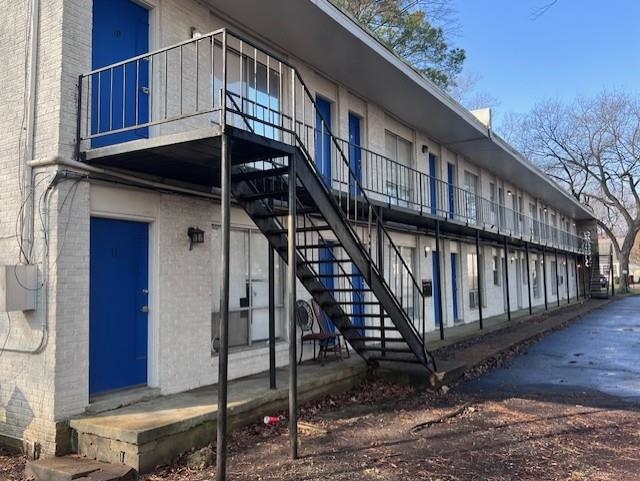 a view of a house with wooden stairs