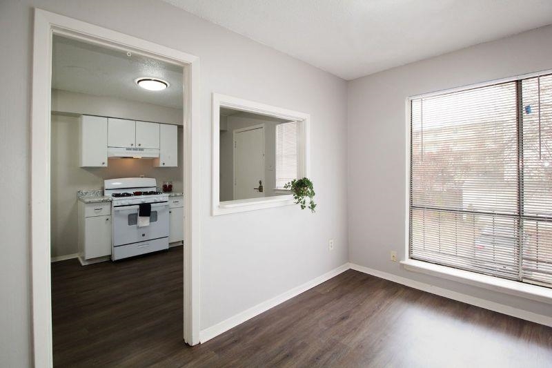 592 Patterson Street Memphis, TN 38111 - Photo 2 of 19 a view of a kitchen with wooden floor electronic appliances and windows