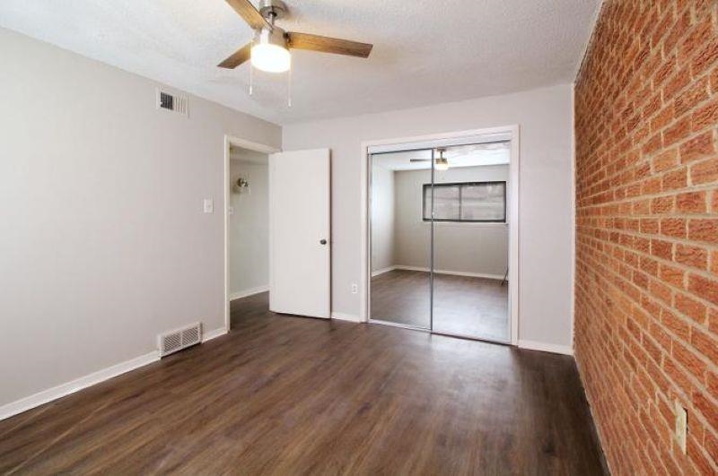 592 Patterson Street Memphis, TN 38111 - Photo 6 of 19 wooden floor in an empty room with a window