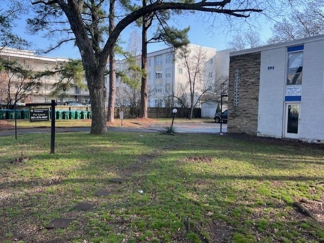 592 Patterson Street Memphis, TN 38111 - Photo 7 of 19 a view of a yard in front of a house with a large tree