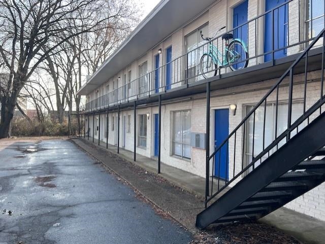 592 Patterson Street Memphis, TN 38111 - Photo 10 of 19 a view of staircase with large windows