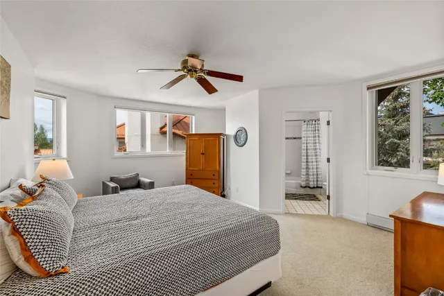 a bathroom with a sink mirror and a bathtub