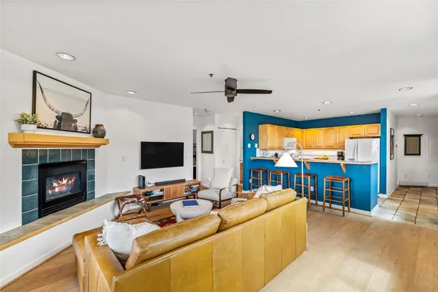 a living room with furniture fireplace and a flat screen tv