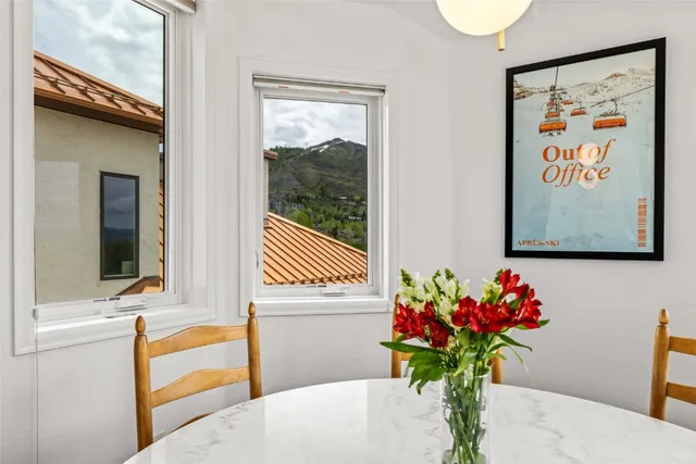 a view of a chair and table on the balcony